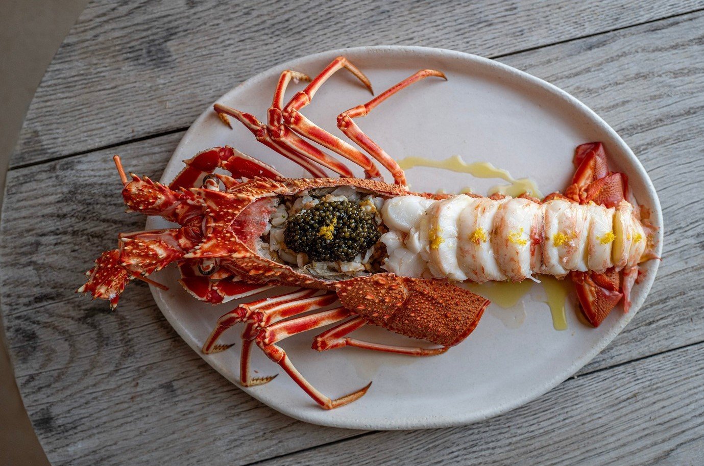 Gourmet lobster dish at a luxury restaurant in Ibiza