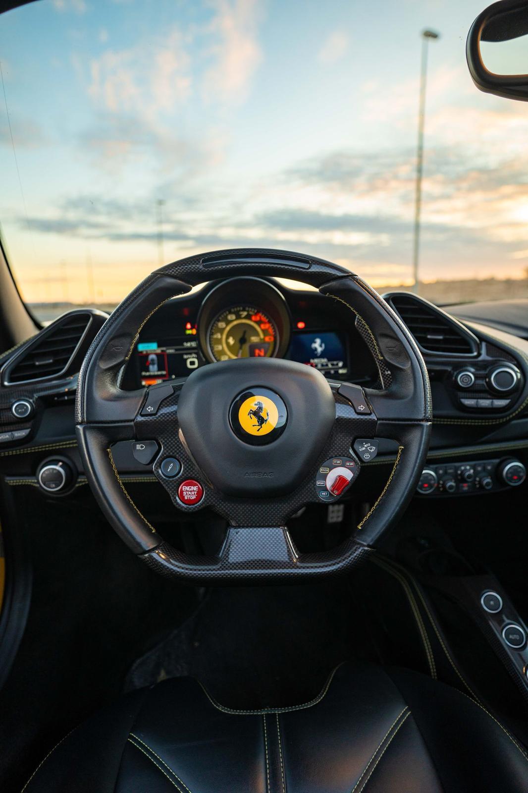 Ferrari steering wheel at sunset in Ibiza